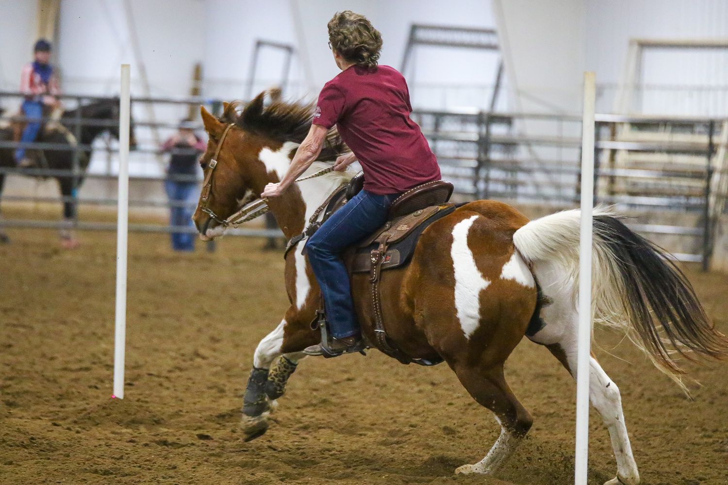 A rider turning hard around a pole
